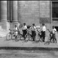 Five boys with bicycles in front of Louisville Free Public Library main branch, 1921.
